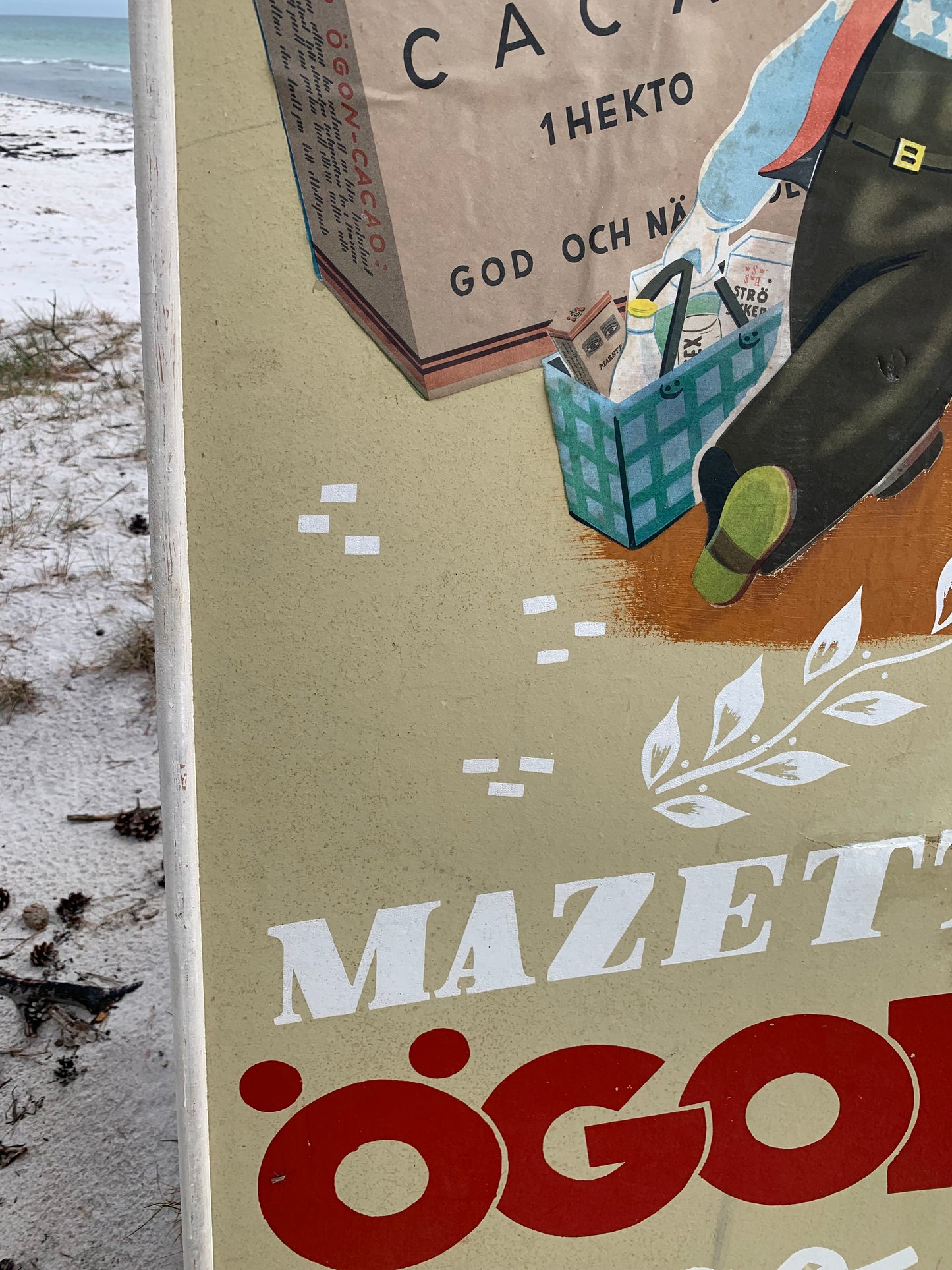Gammelt Mazetti reklameskilt i træramme